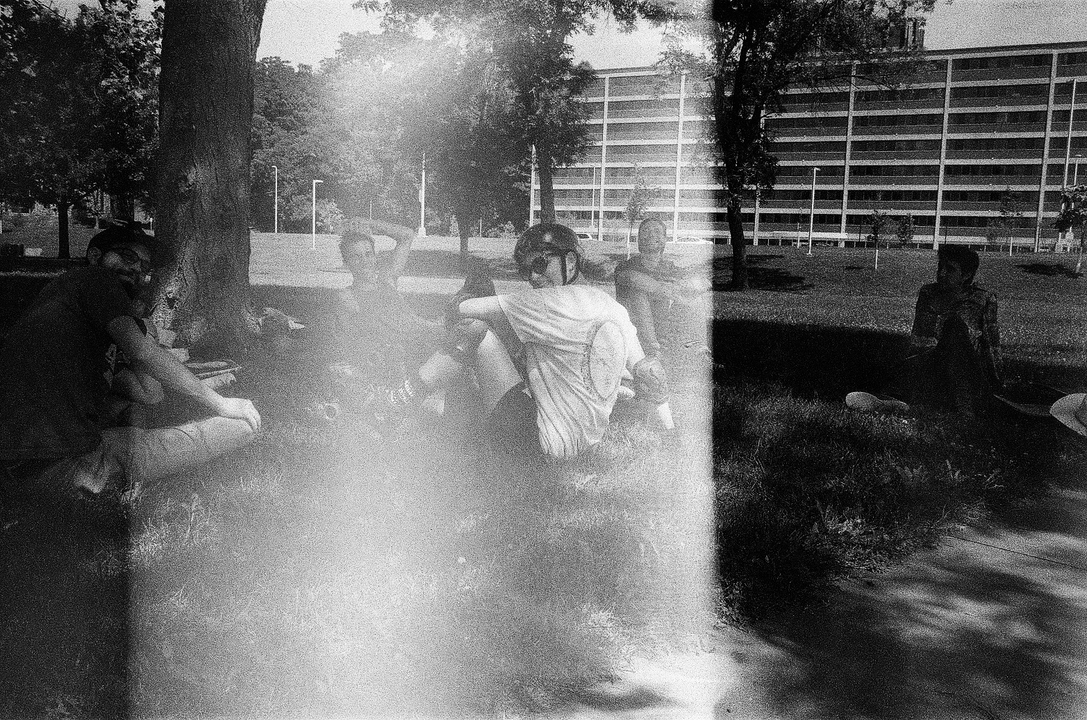 People sitting on grass.